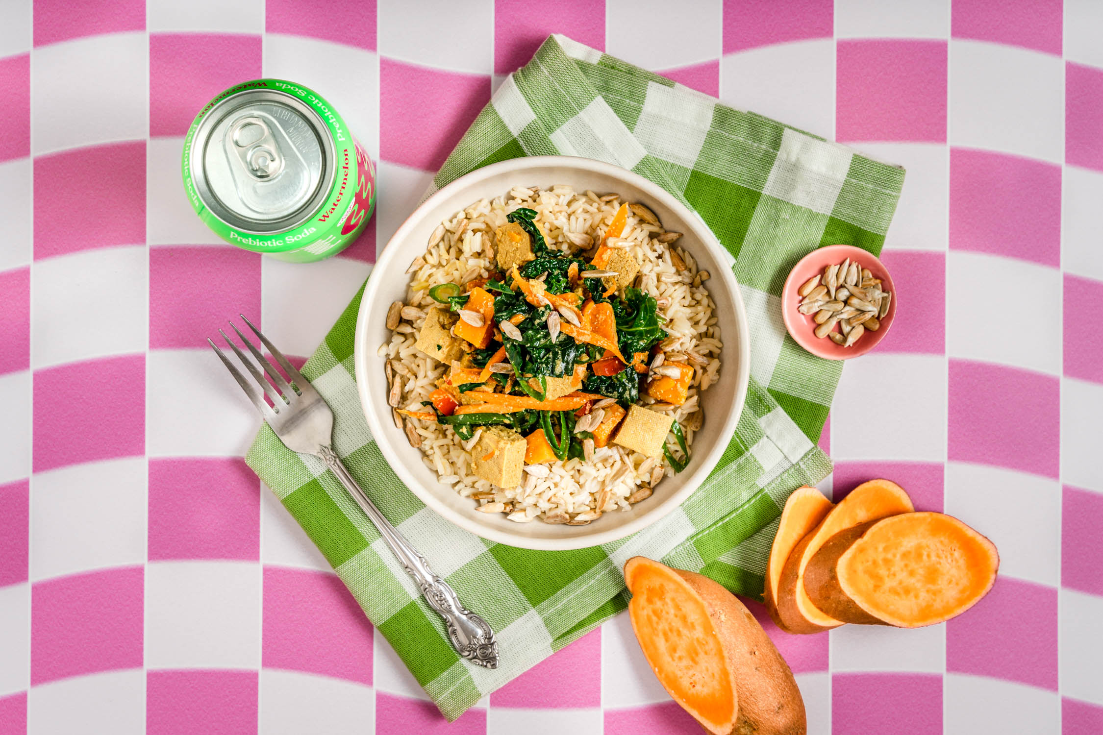 Plate of tofu and kale stew on a bed of rice