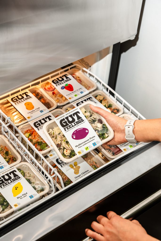 Frozen meal being taken out of freezer.