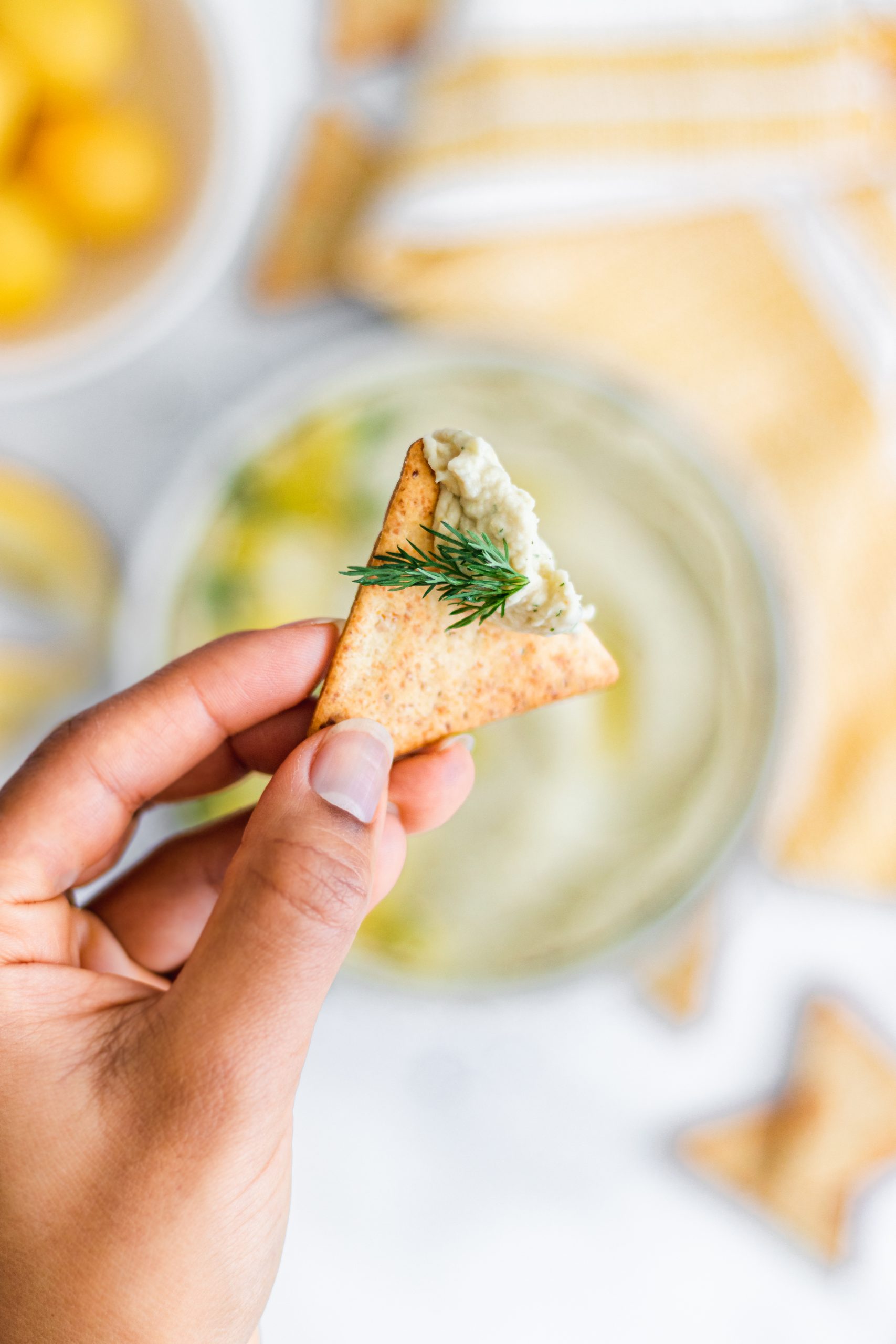 Cannellini lemon dip on triangle cracker