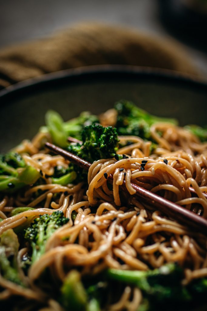 Closeup of broccoli and peanut butter noodles