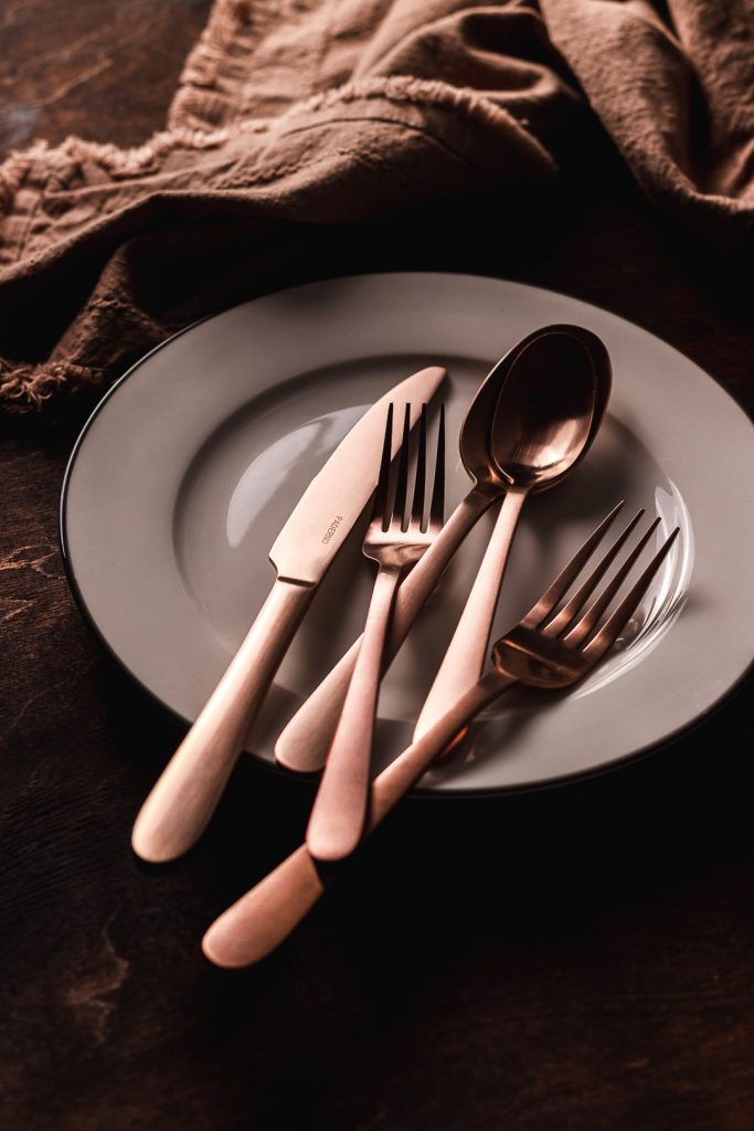 Closeup of copper utensils by Paderno