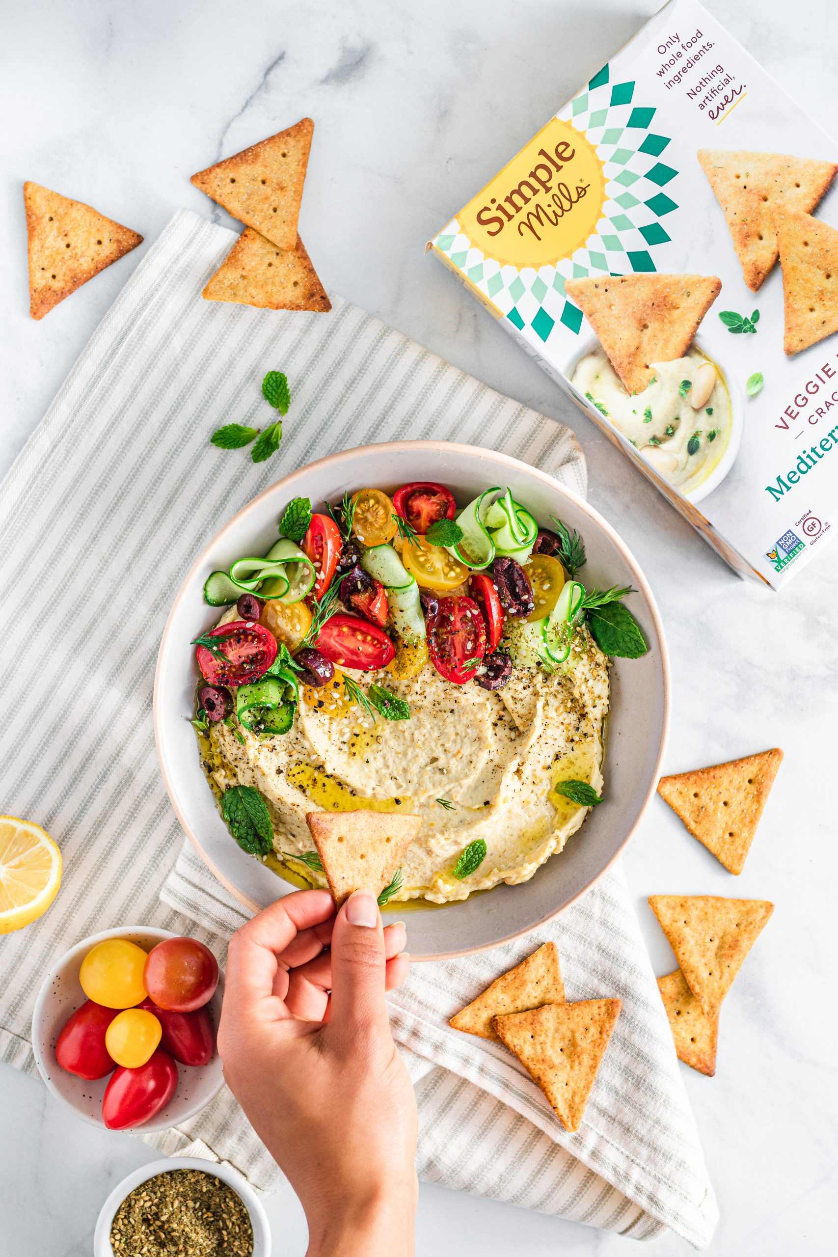 Greek dip surrounded by crackers