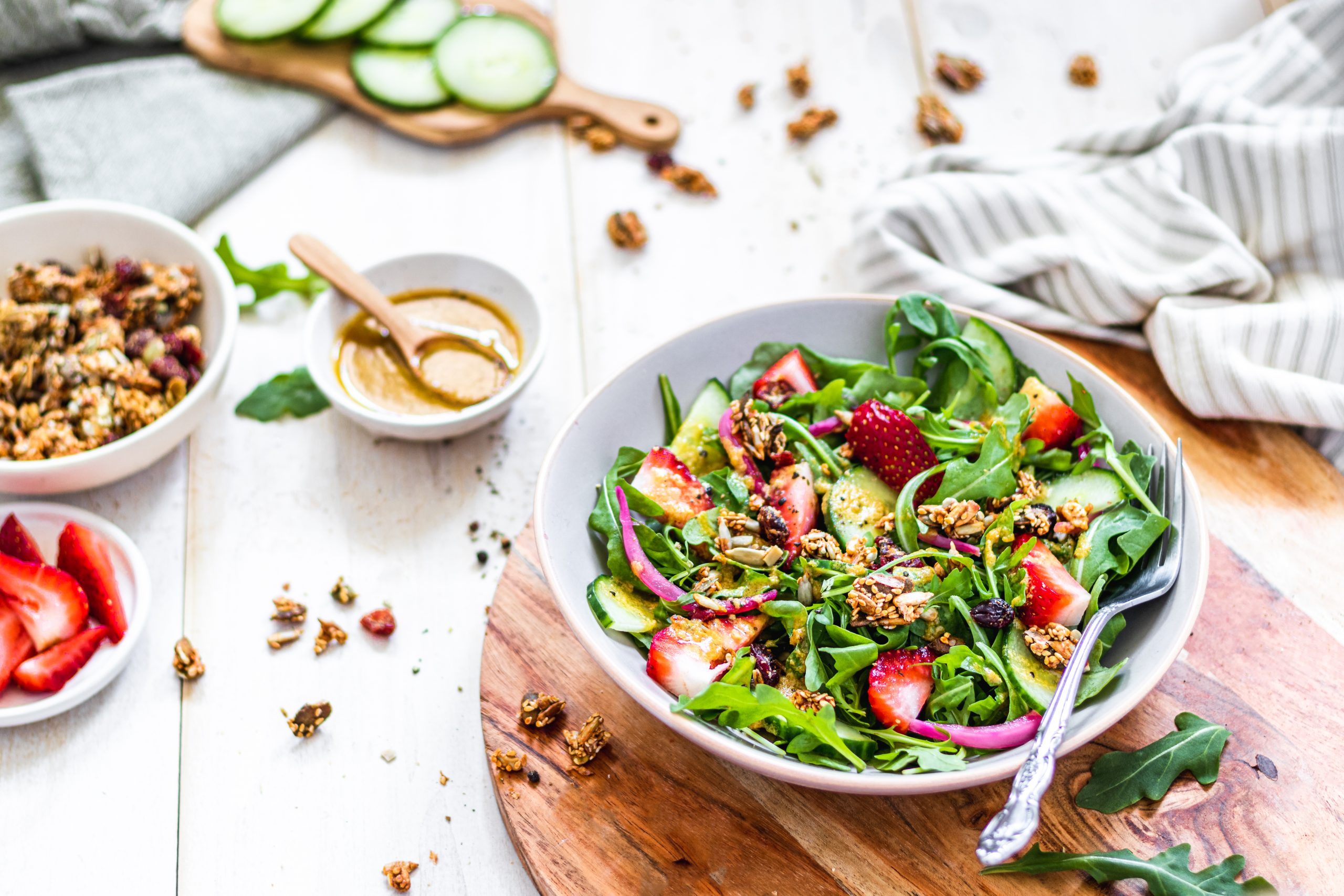 Green salad in a plate with vegan seed topping