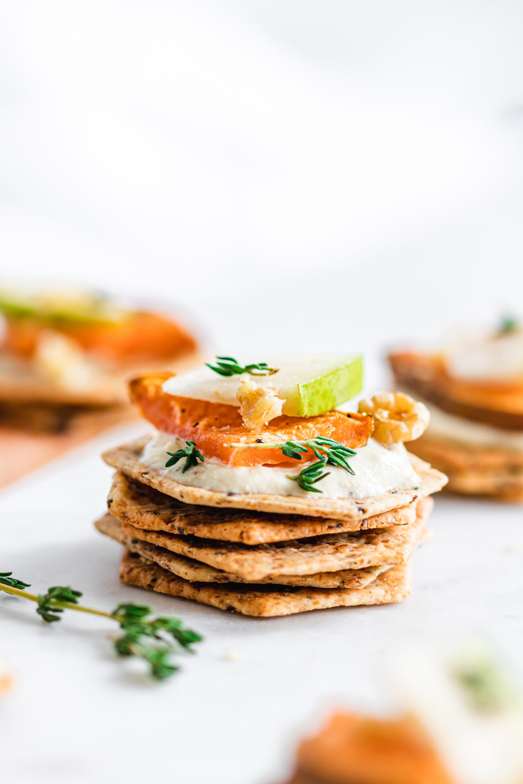 Sweet potato crackers topped with apple, and thyme