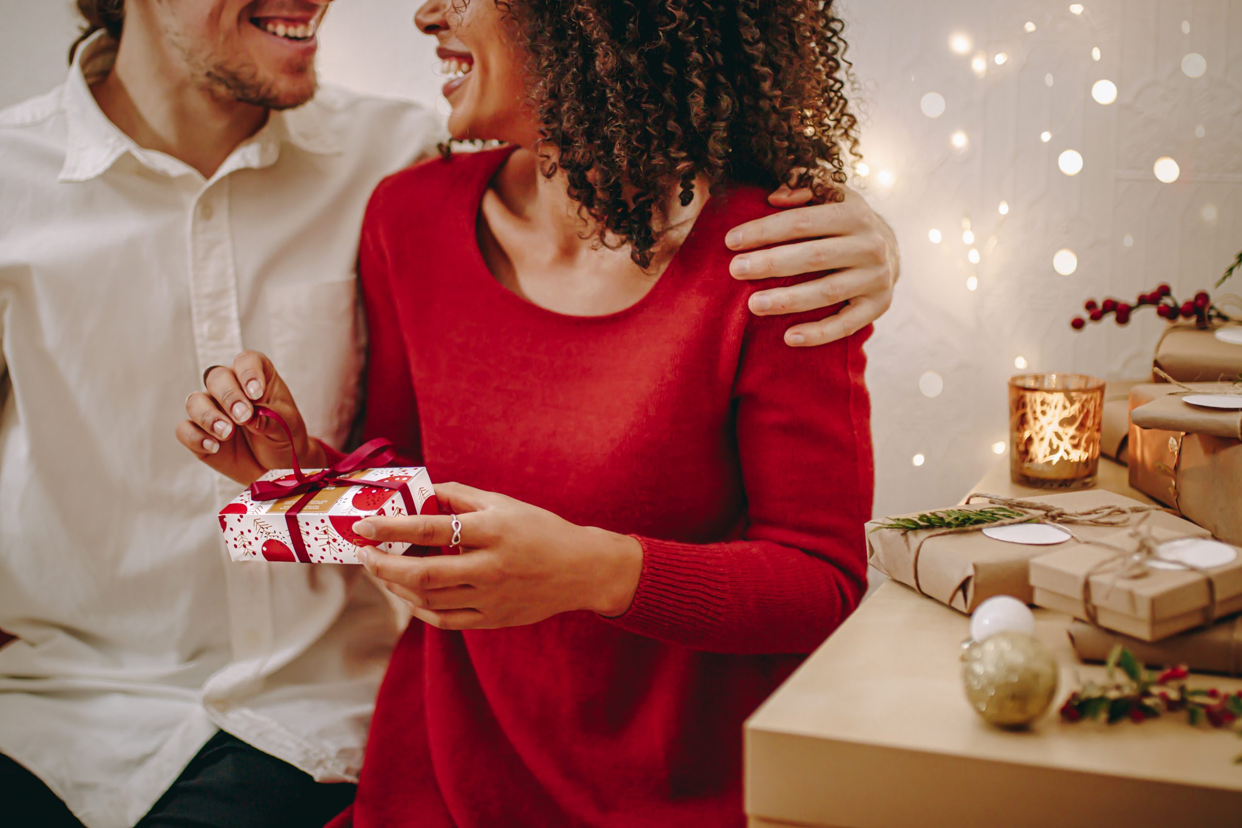 Couple in holiday setting enjoying chocolate together