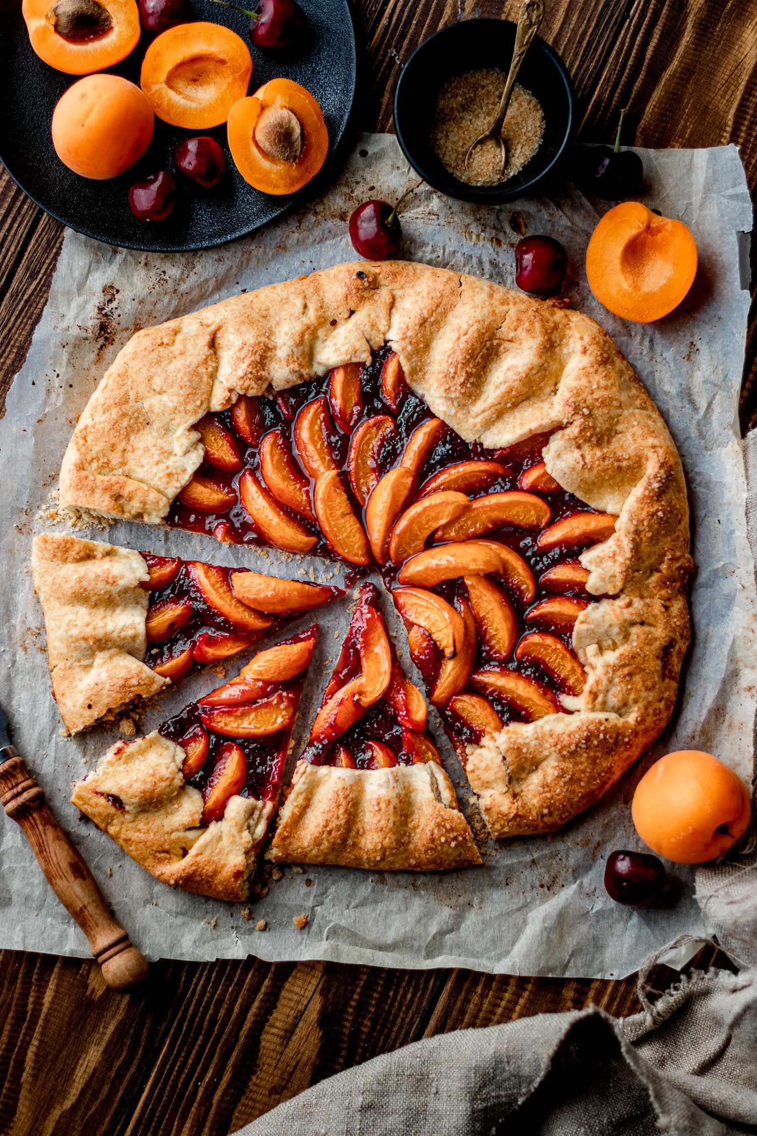 Overhead of Apricot Cherry galette with 3 slices cut out.