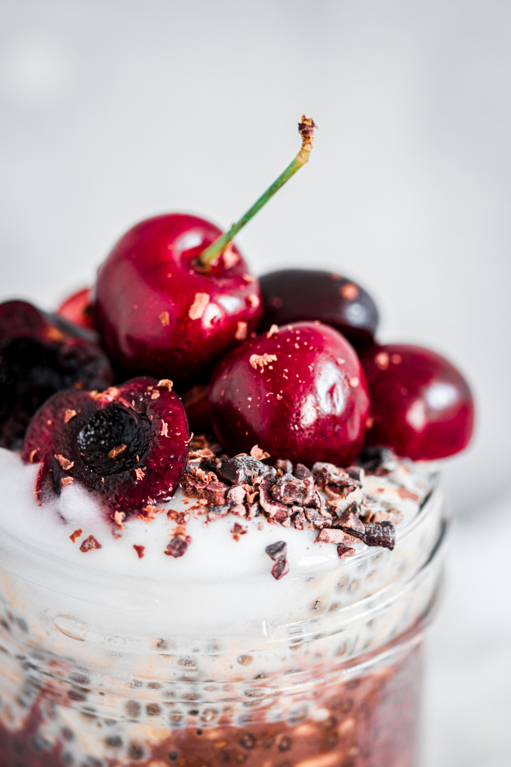 Closeup of cherries garnished on overnight oats