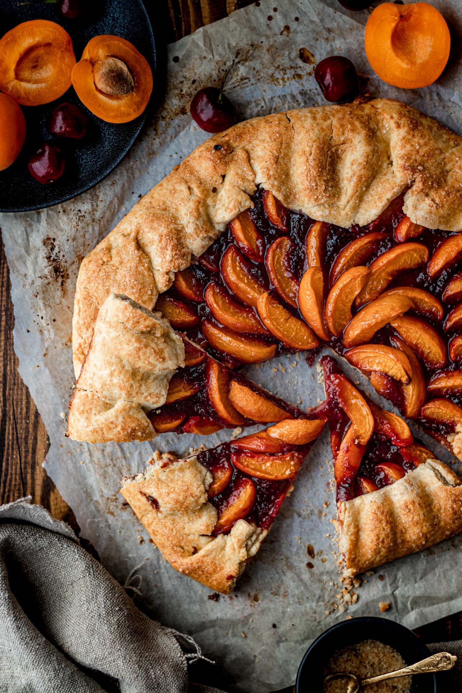 Overhead of Apricot Cherry galette with 3 slices cut out.