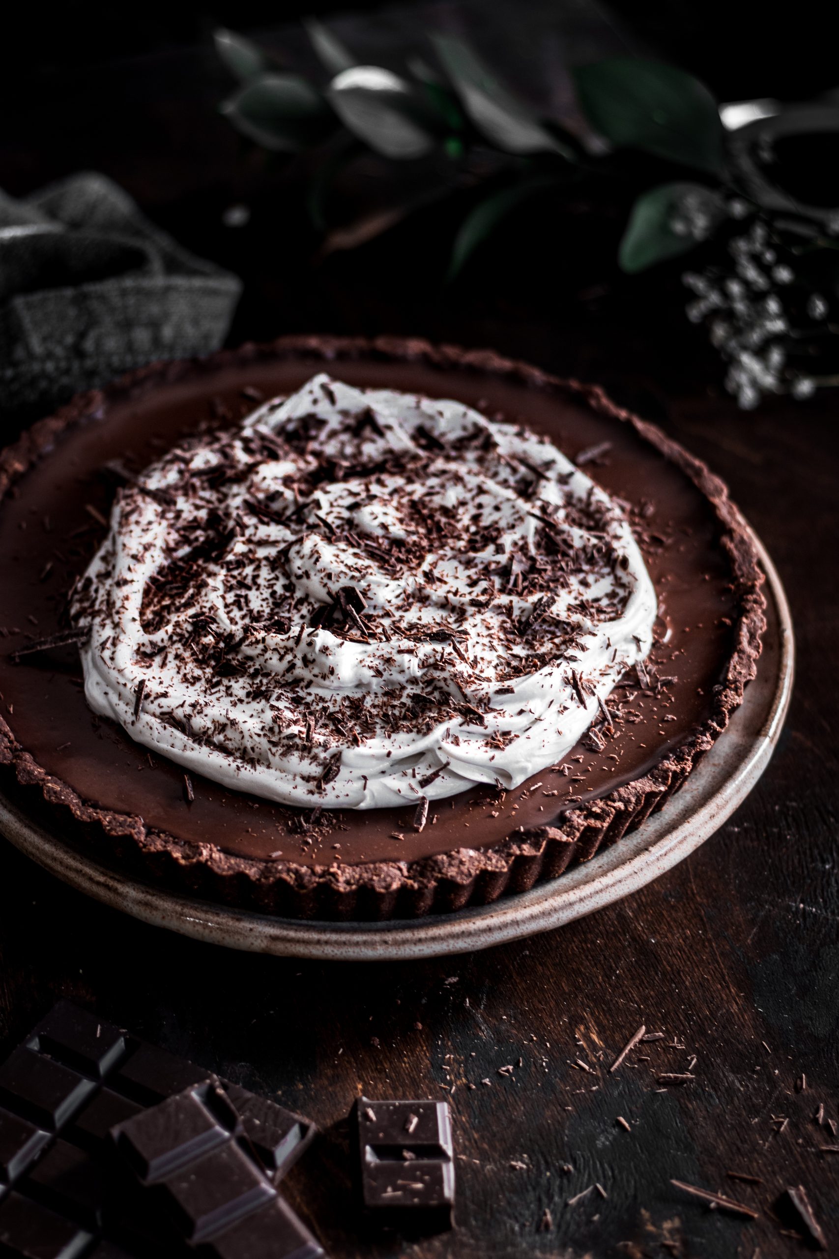 Chocolate Espresso Tart garnished with coconut whipped cream.