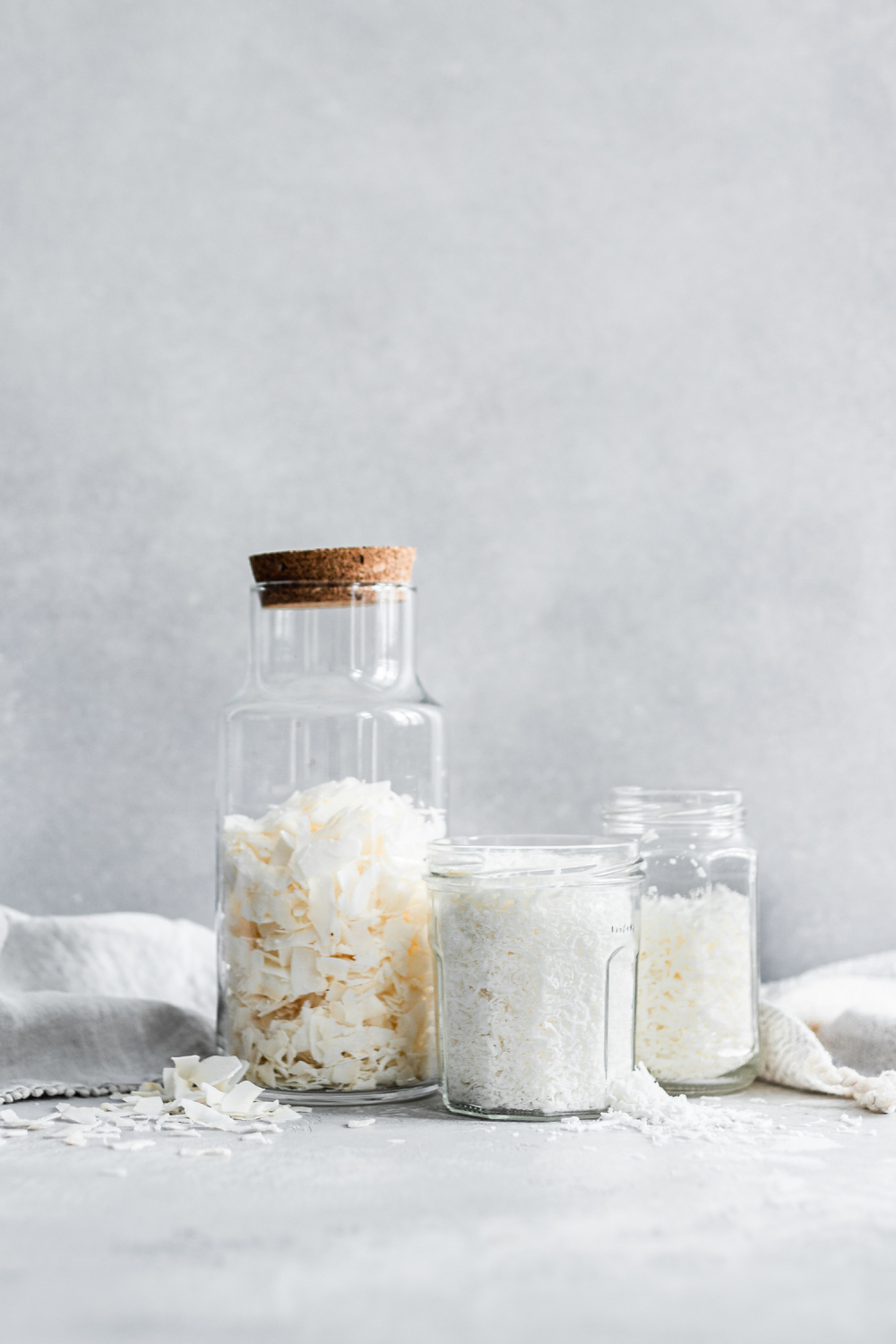 Various kinds of dried coconut in jars.