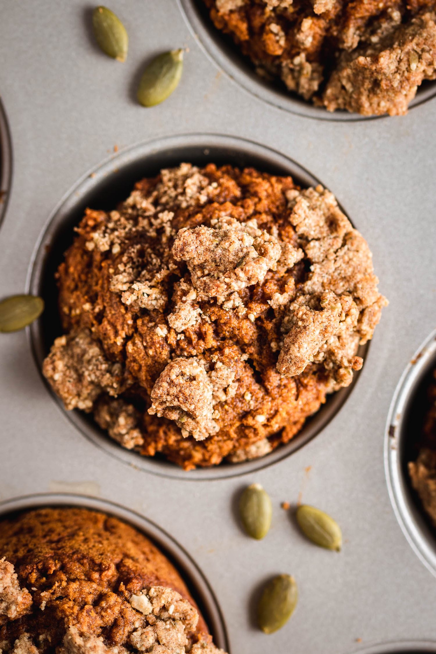 Overhead shot of pumpkin muffin in muffin pan.
