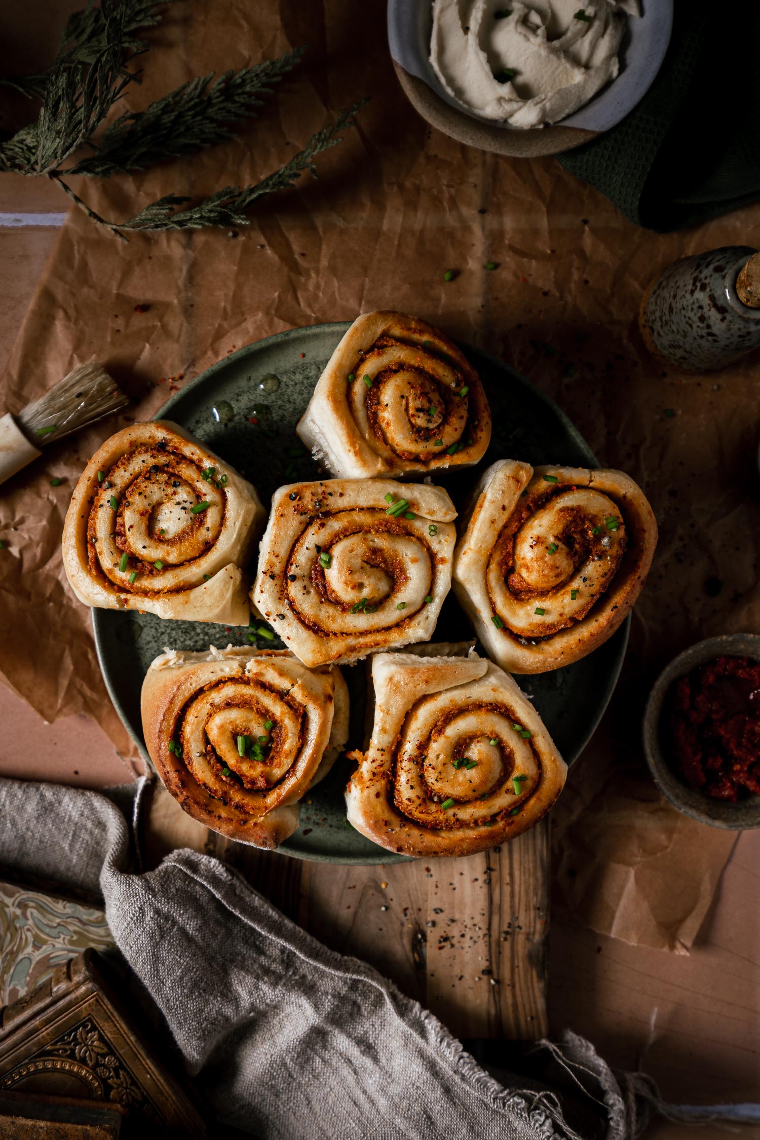 Overhead shot of sundried tomato rolls on a green plate