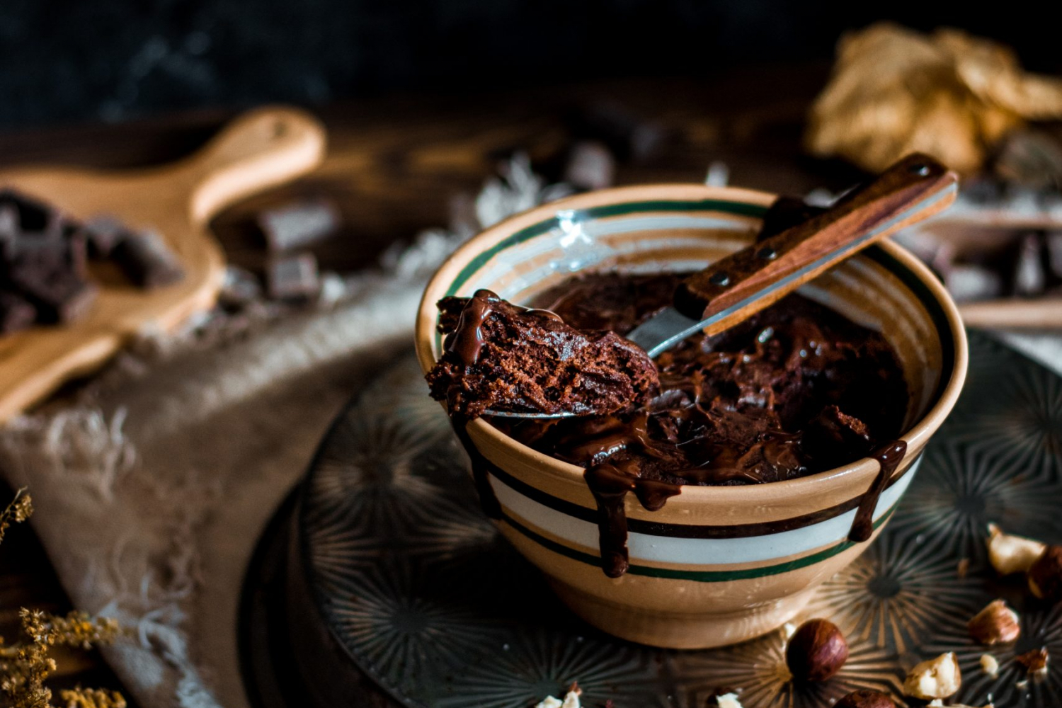 Spoon taken out of chocolate mug cake.