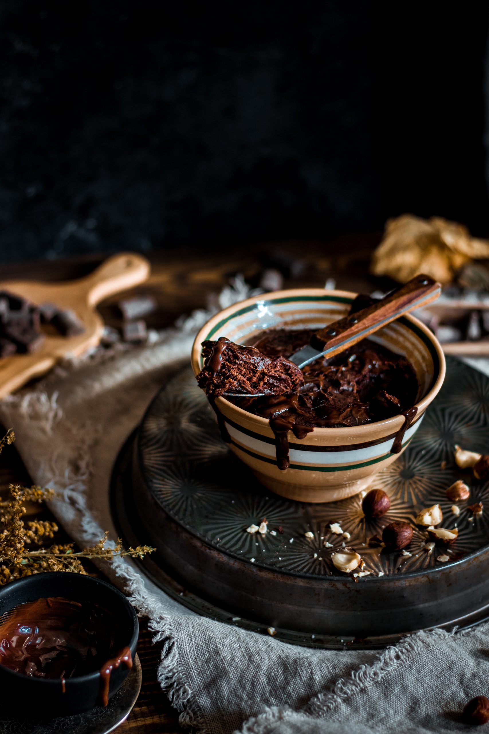 Spoon taken out of chocolate mug cake.