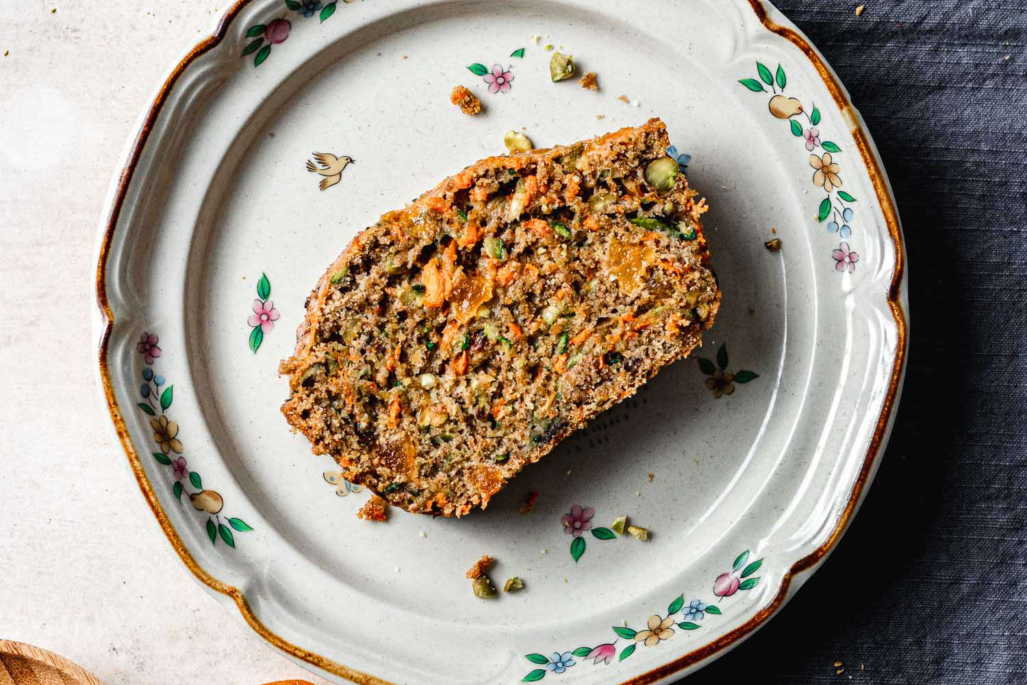 Slice of Carrot Zuchhini Bread on a plate.