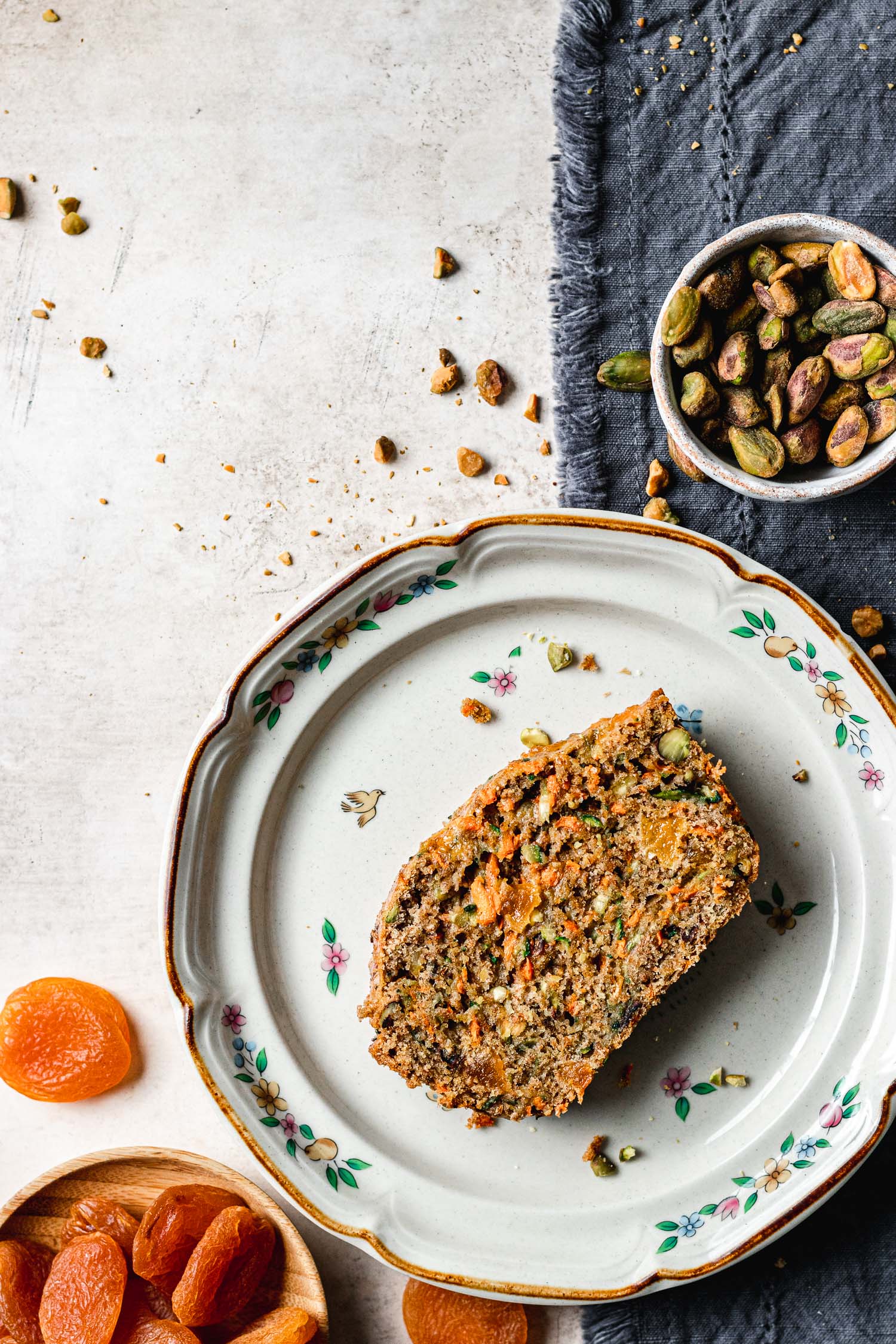 Slice of zucchini carrot bread on plate.