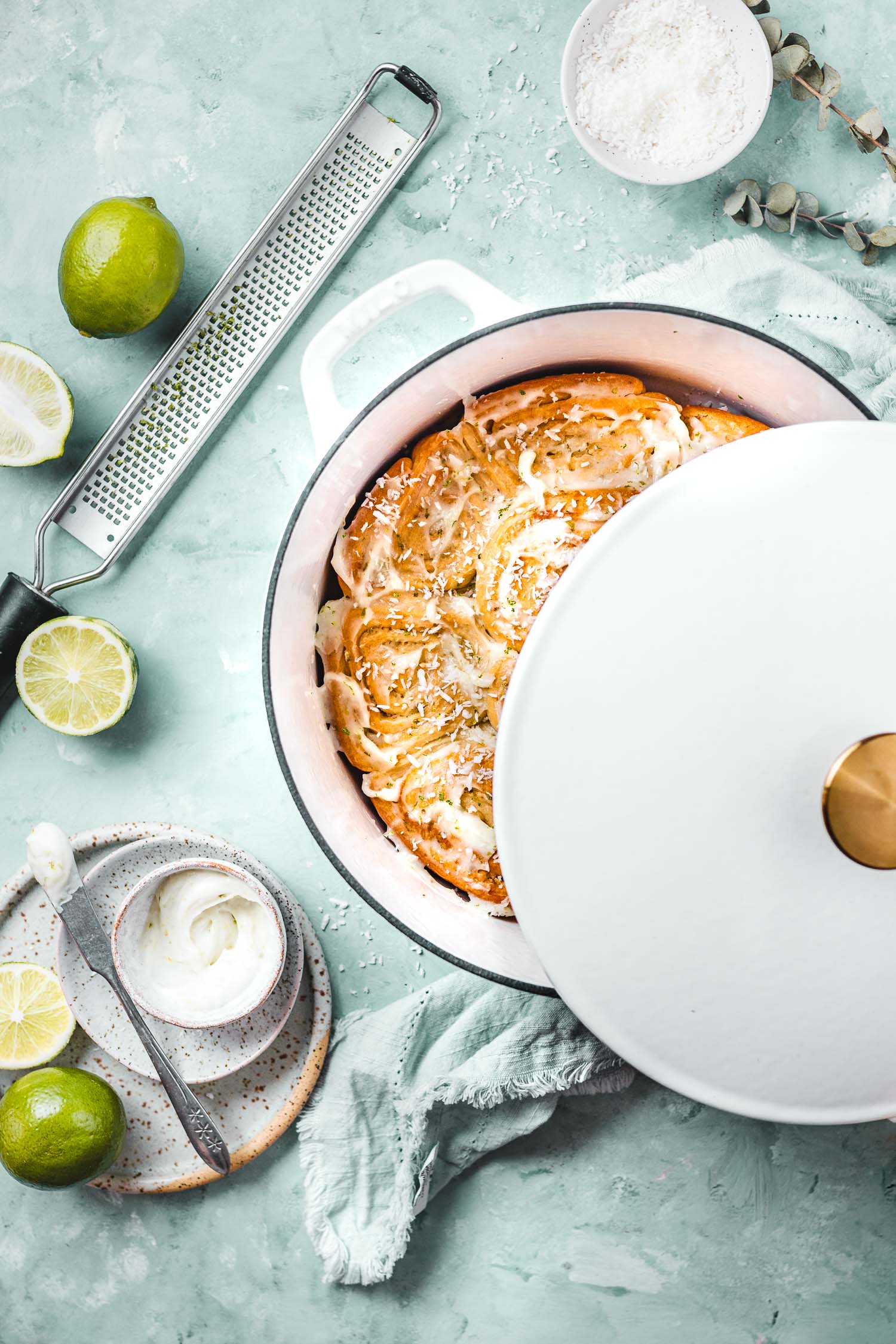 Buns in Dutch Oven with the lid showing the buns under.