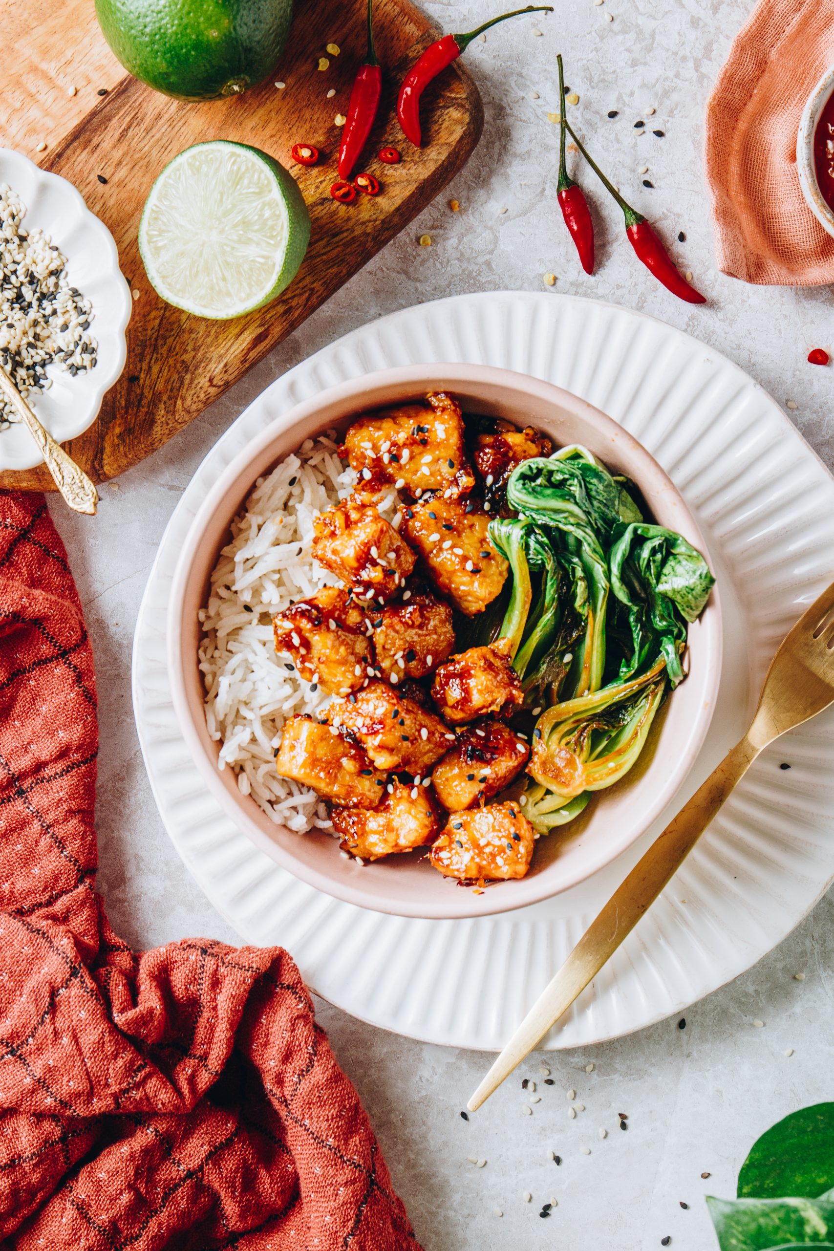 Overhead of Apricot Glazed Tempeh in bowl with rice and bok choy.