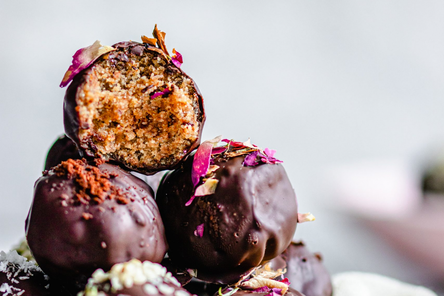 Cardamom and Coffee Dark Chocolate Truffles with bite taken out