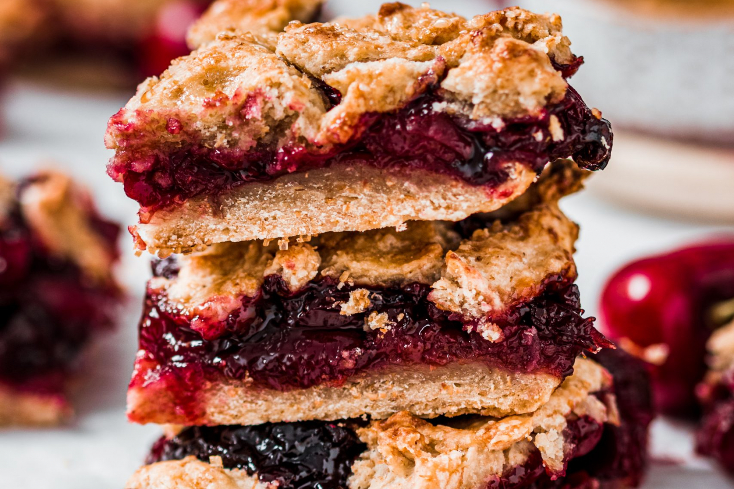 Cherry Pie Bars stacked one on top of another.