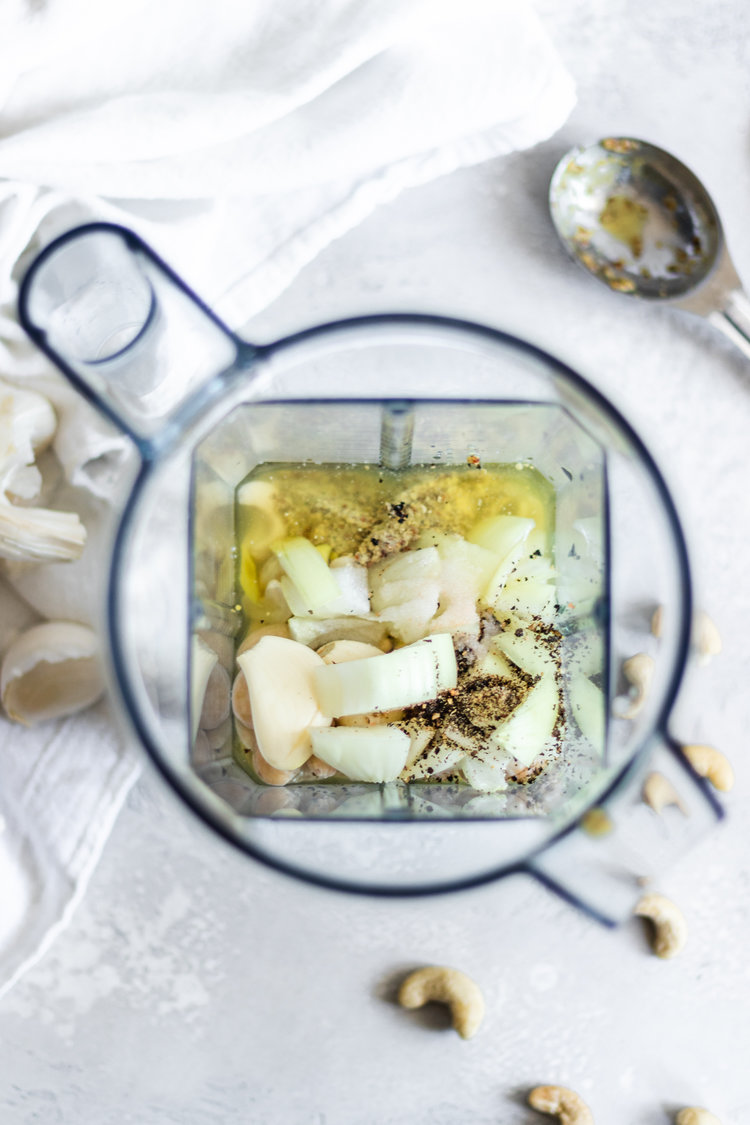 Overhead of all dressing ingredients into a vitamix cup