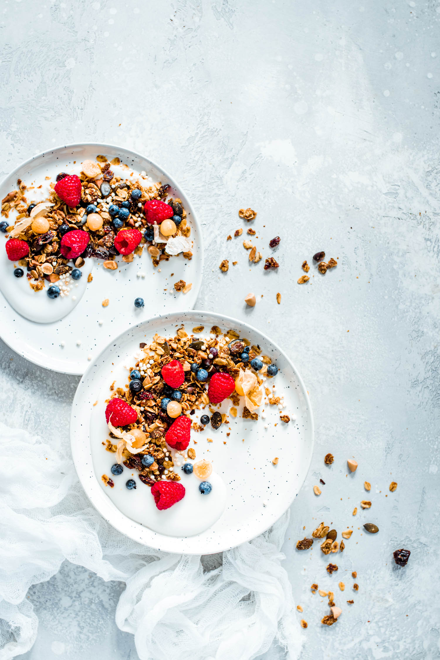 Bowl of yogurt topped with granola and fruits