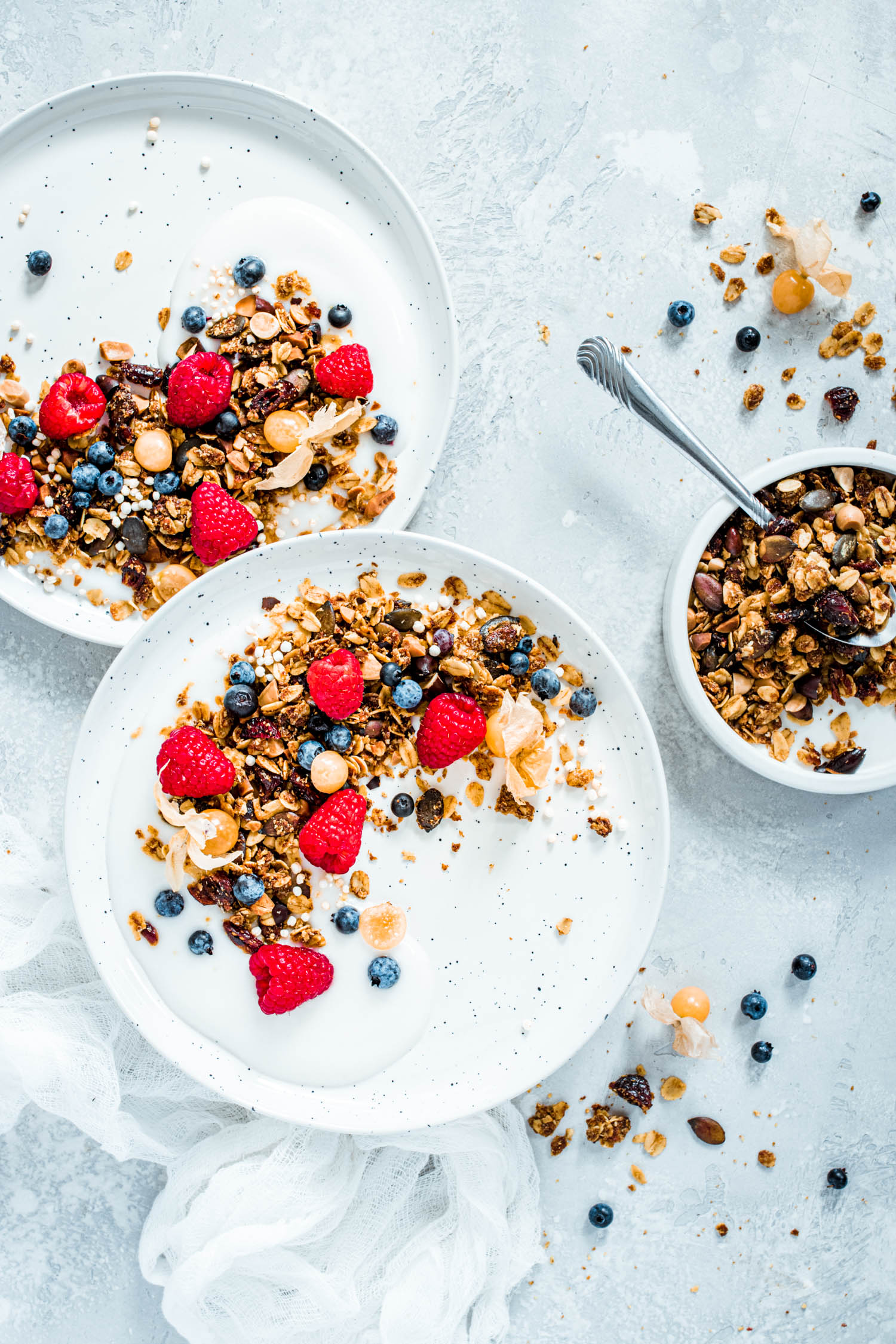 Nut free granola in a bowl with yogurt and berries