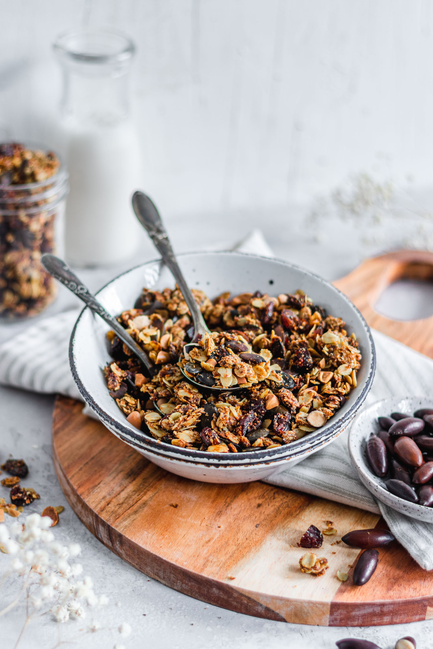 Nut free granola in a bowl with two spoons