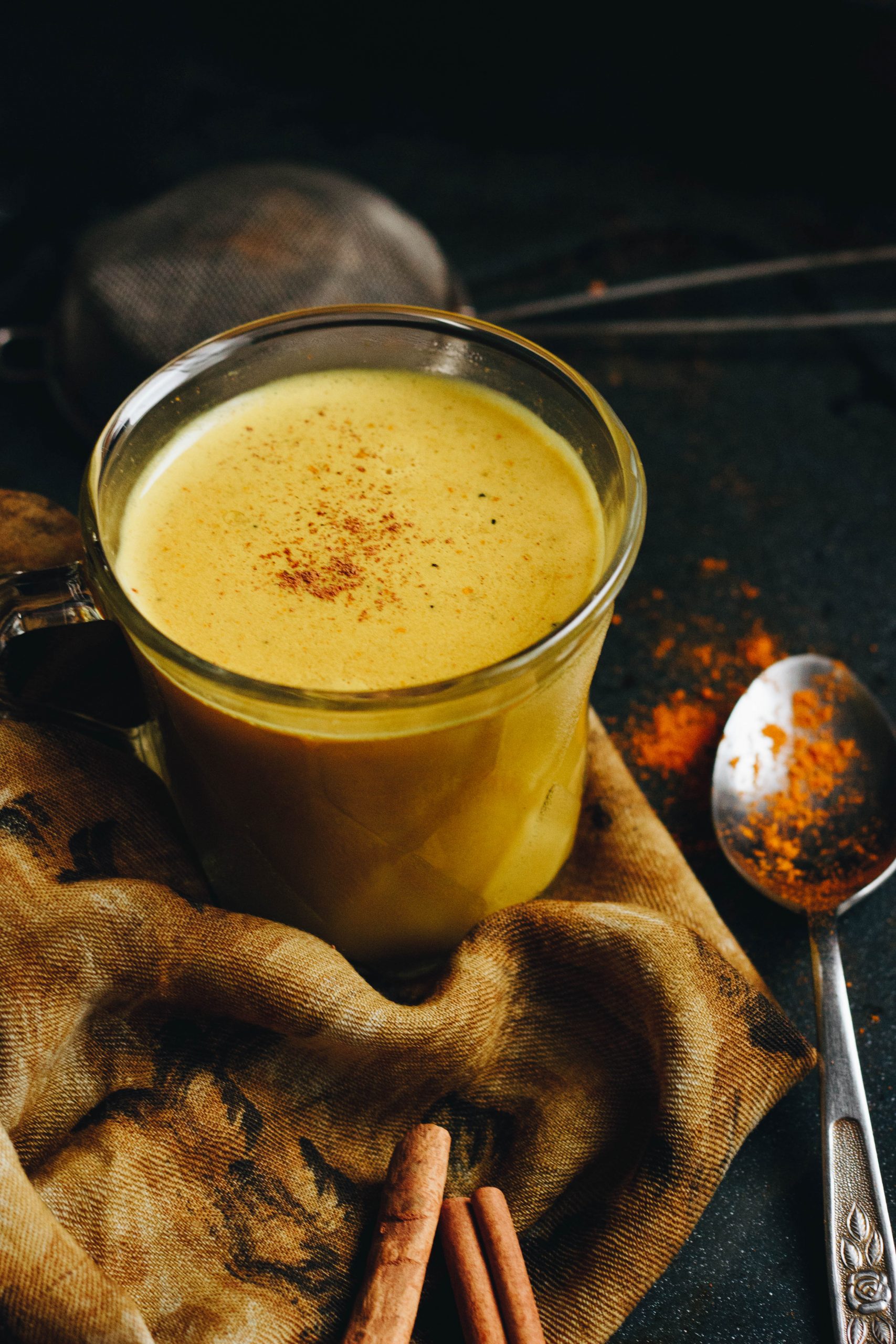 Golden milk topped with ground cinnamon