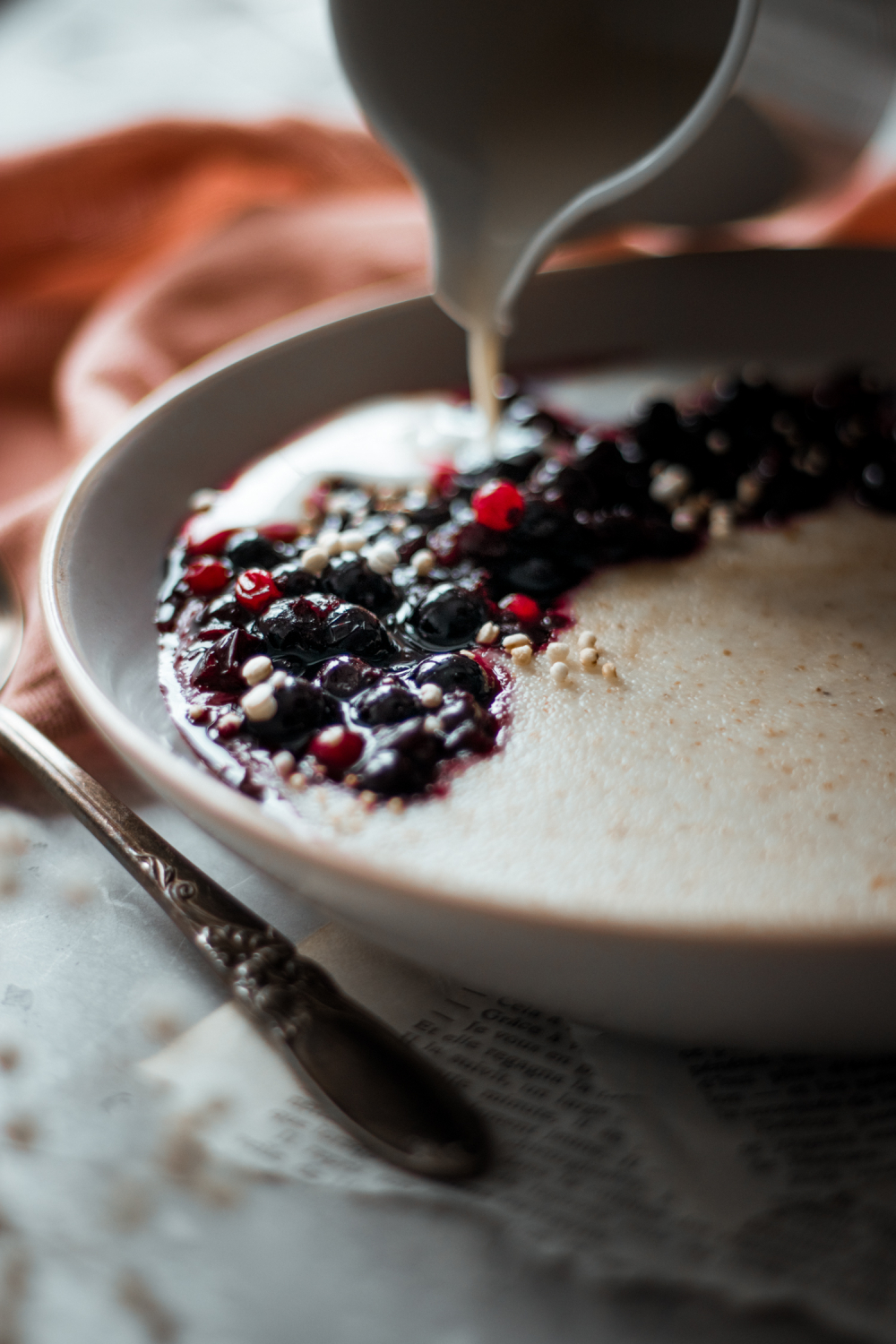 Milk being poured into a bowl with cream of wheat