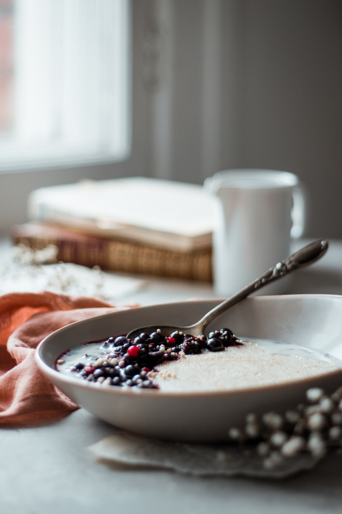 Glistening berries in a bowl of cream of wheat