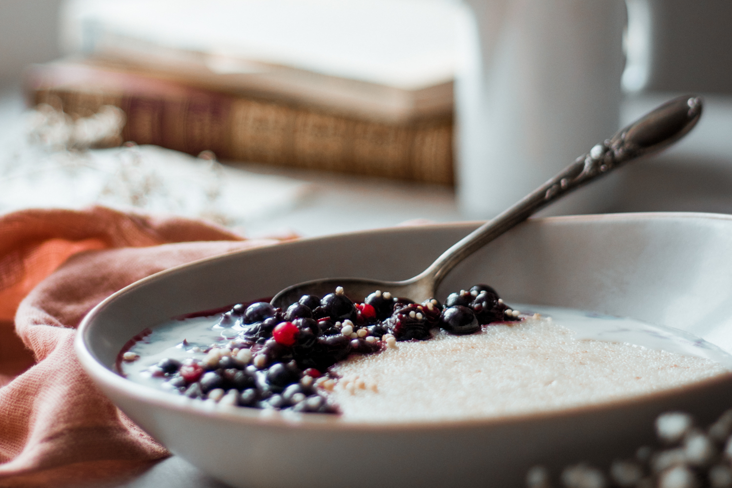 Glistening berries in a bowl of cream of wheat