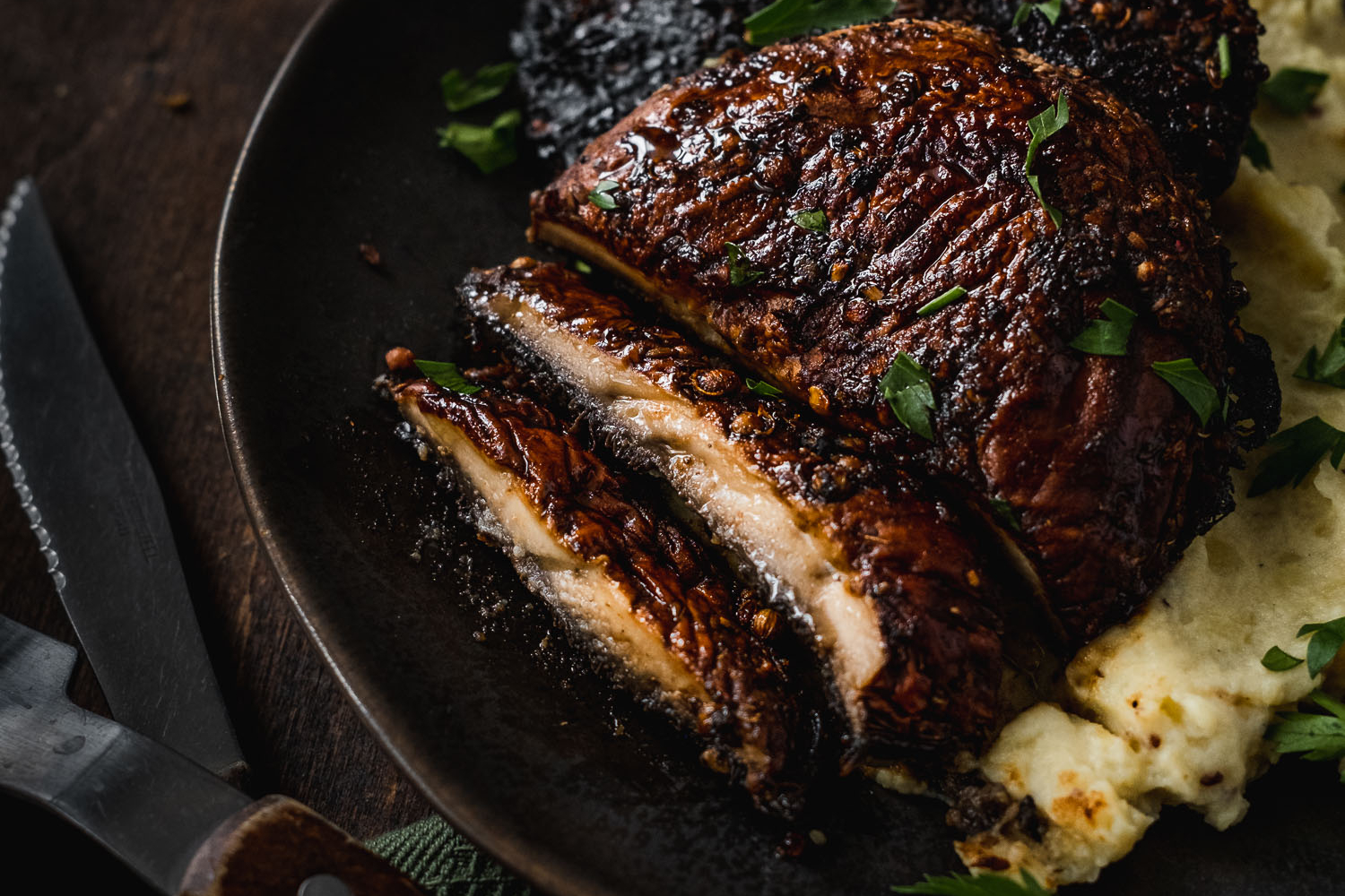 Portobello steak sliced and served with mashed potatoes