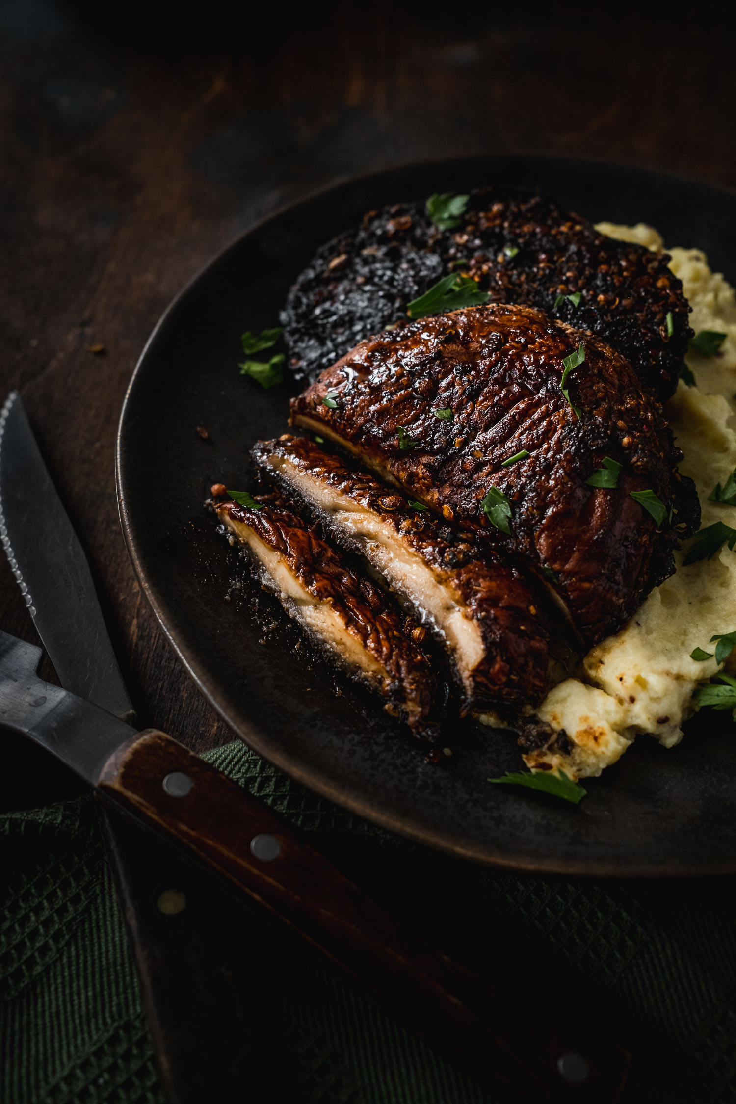 Portobello steak sliced and served with mashed potatoes
