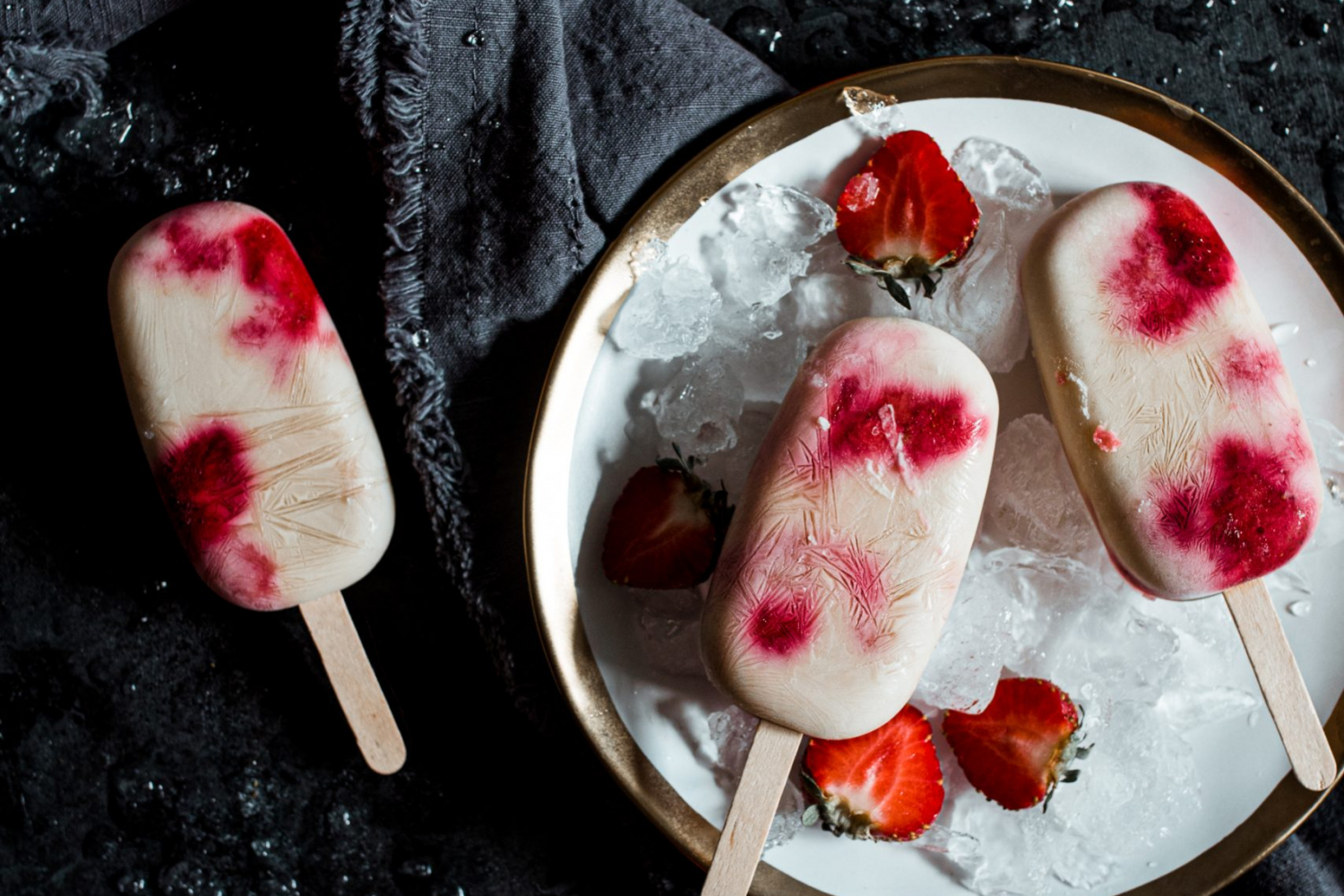 3 Strawberry shortcake pops on a plate