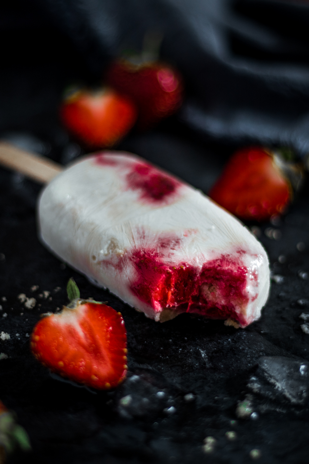 Bite taken out of strawberry shortcake pop