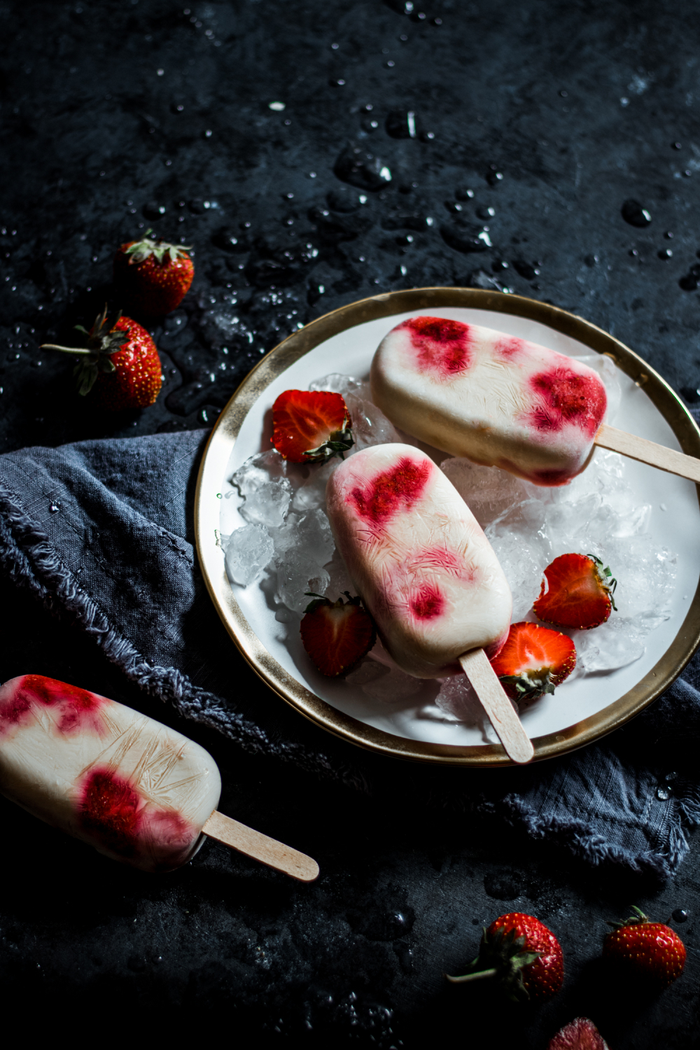 3 Strawberry shortcake pops on a plate
