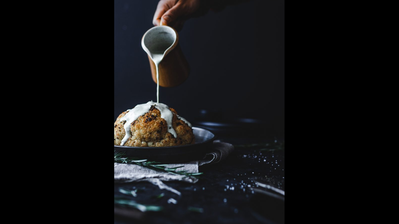 Whole Roasted Cauliflower with Rosemary Garlic Creamy Sauce | Murielle Banackissa
