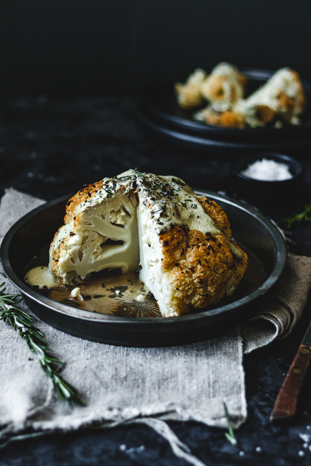 Whole roasted cauliflower with slice taken out