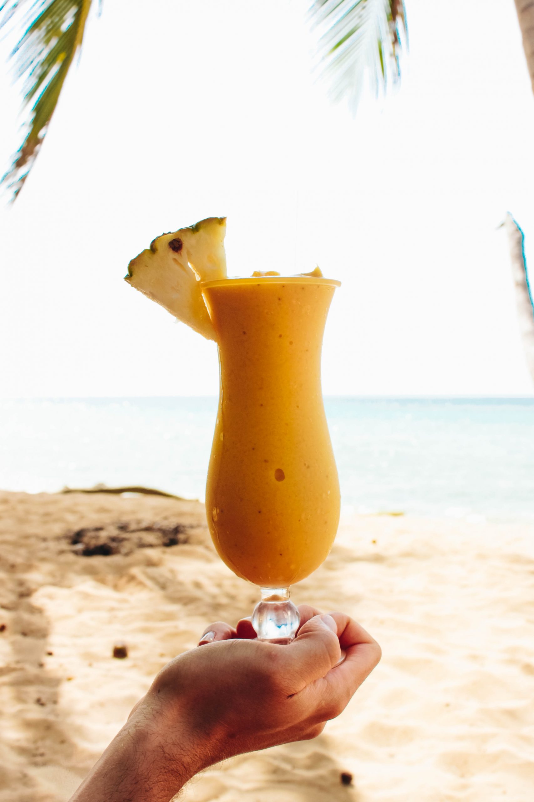 Tropical Mango Coconut Smoothie on the beach