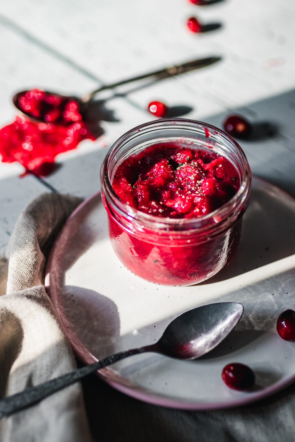 homemade cranberry sauce in a glass mason jar