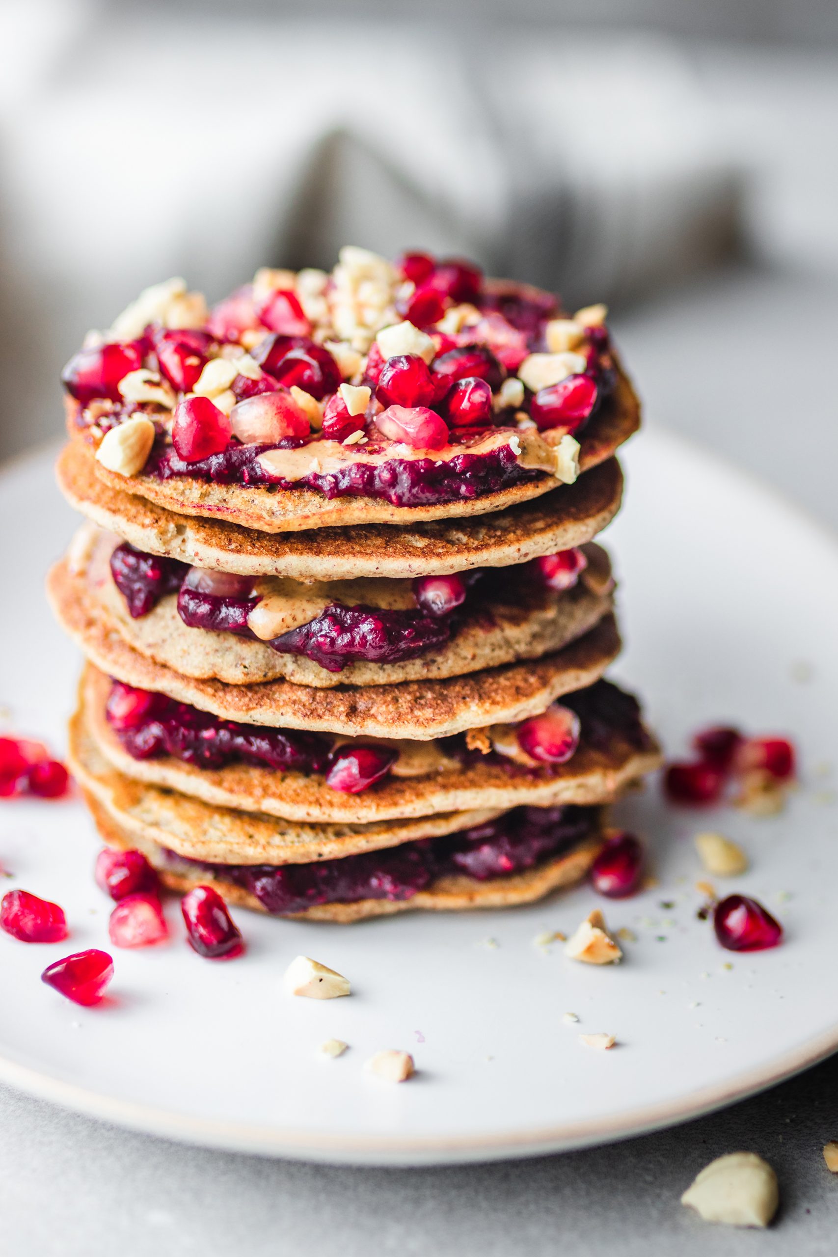 The Fluffiest Gluten Free Sugar Free Pancakes Stacked with berries and nut butter