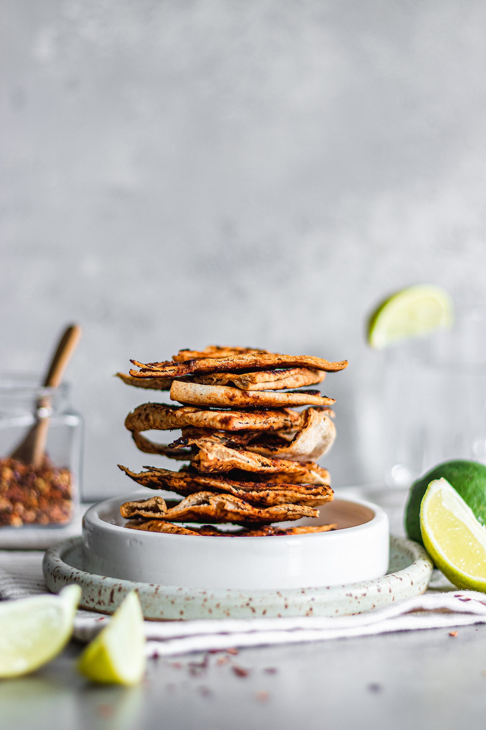 Stack of Whole Wheat Chili and Lime Pita Chips on a plate