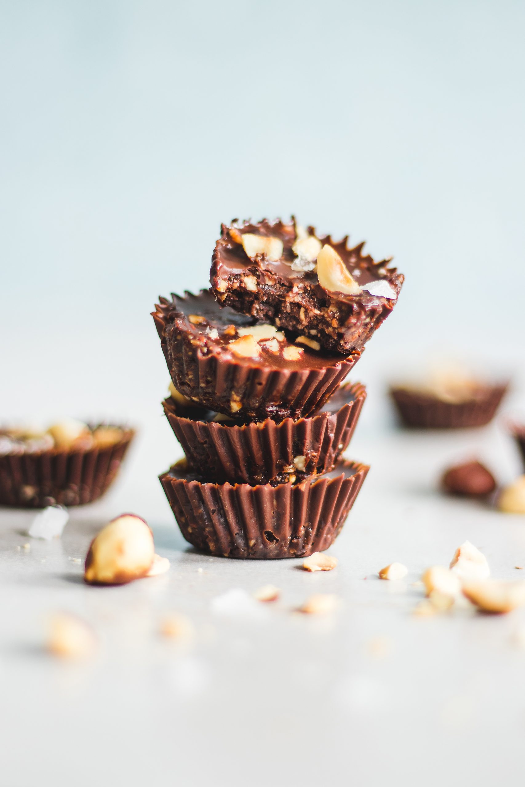 Decadent Chocolate and Hazelnut Cups Stacked with Bite Taken out of one