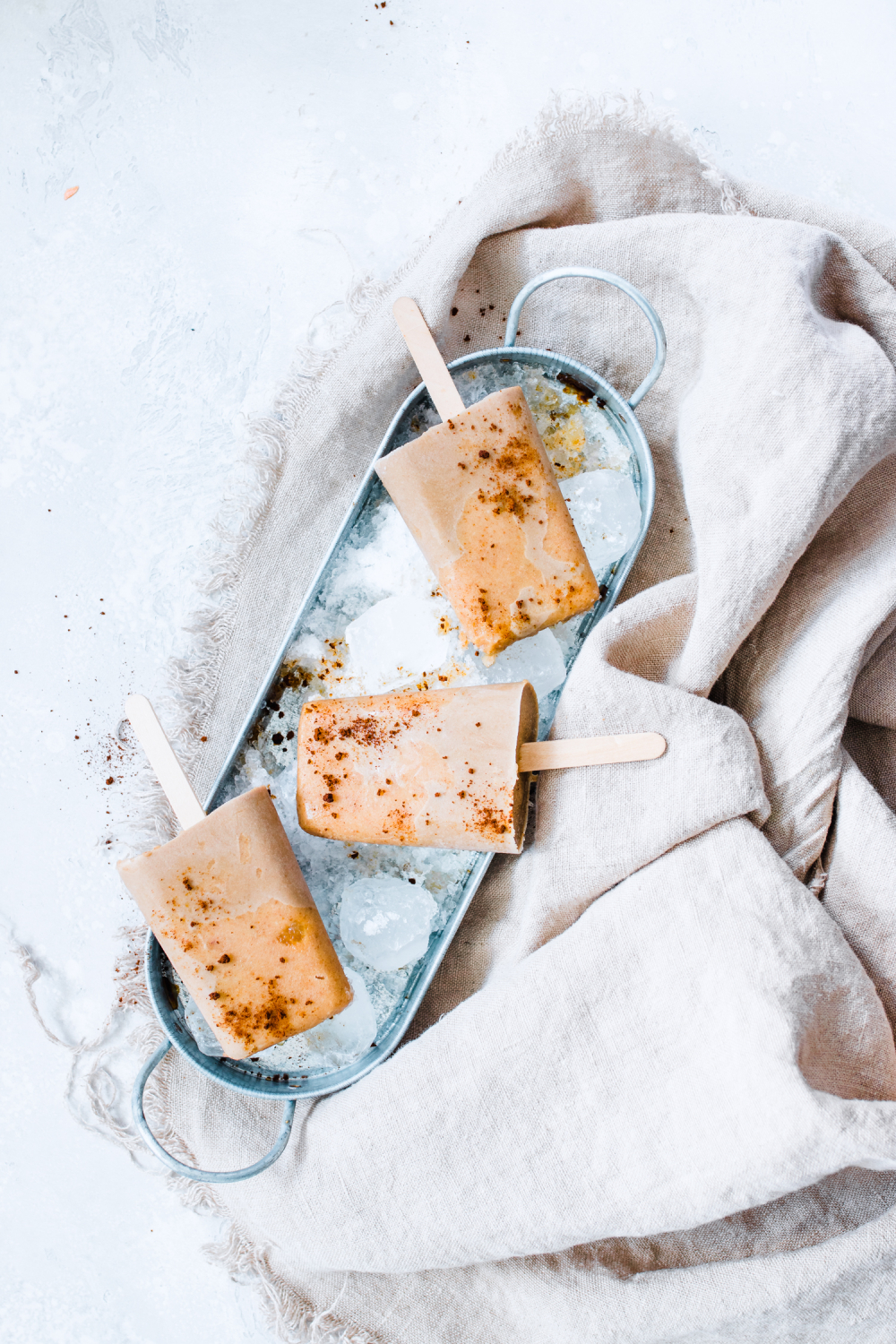 Salted Caramel Latte Pops in a tray with ice