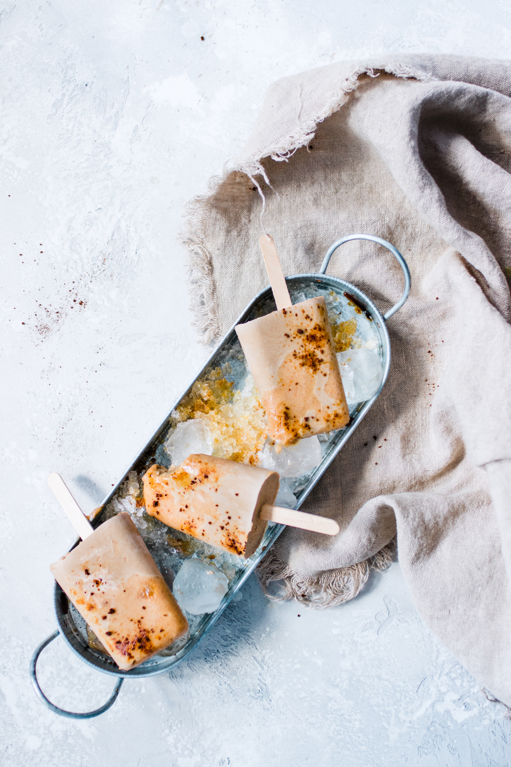 Salted Caramel Latte Pops in a tray with ice