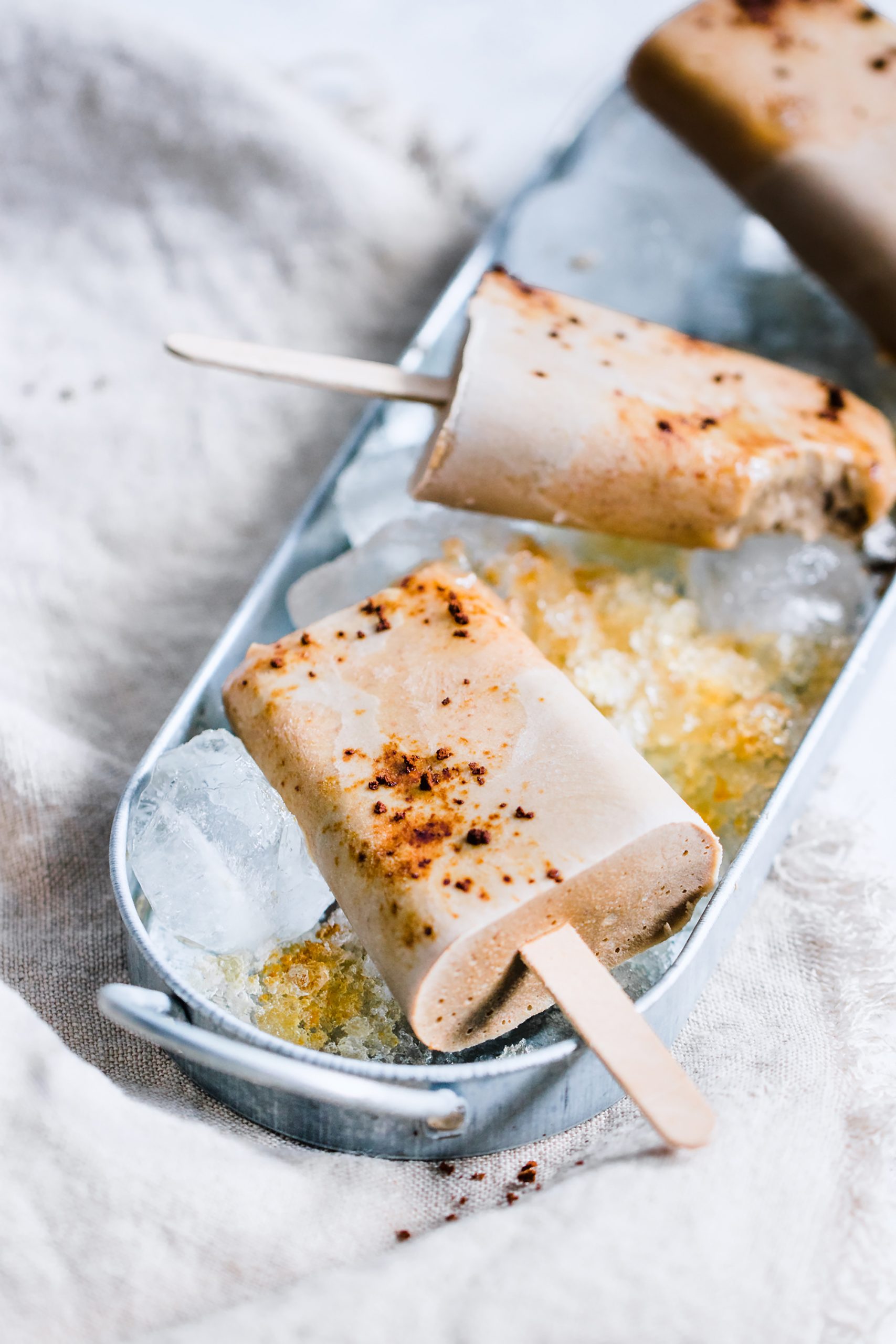 Salted Caramel Latte Pops in a tray with ice