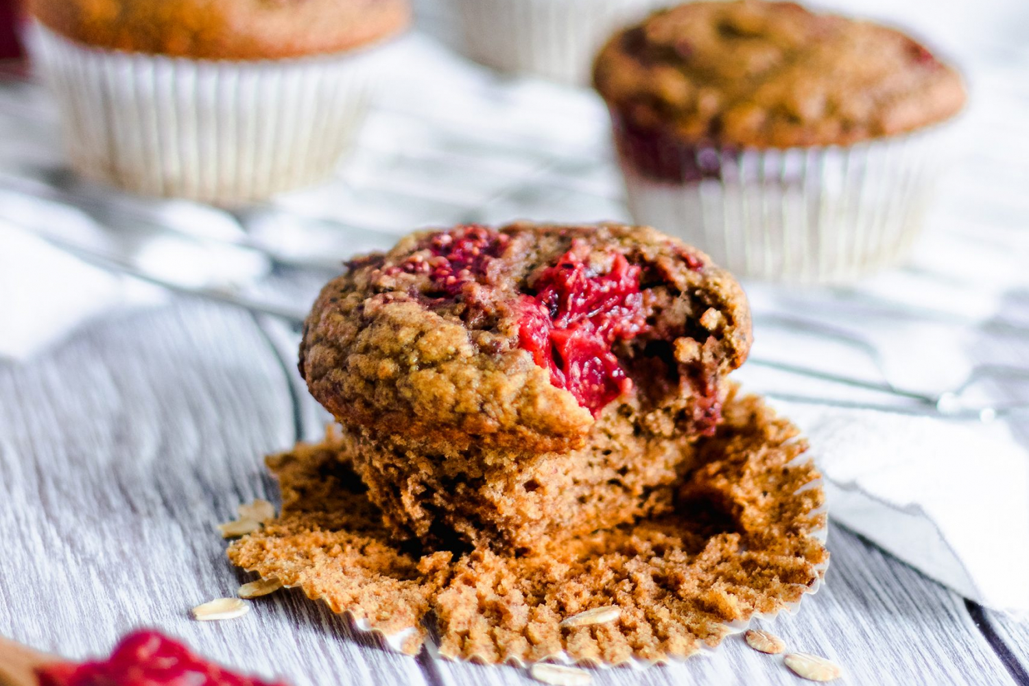 Strawberry Jam Swirl Muffins with bite taken out
