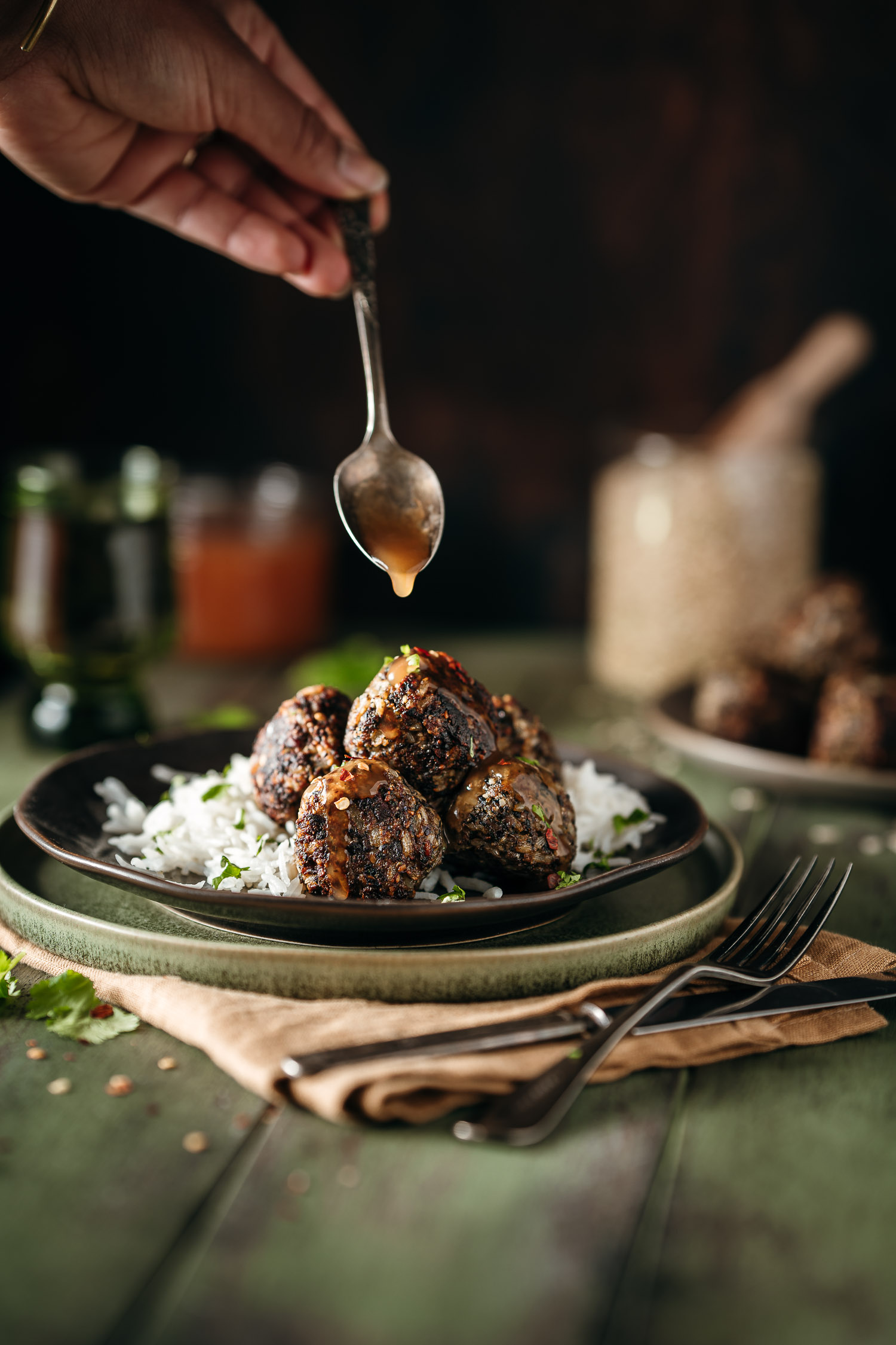Shiitake and Rice Meatballs with Sweet and Sour Sauce Glazed being poured