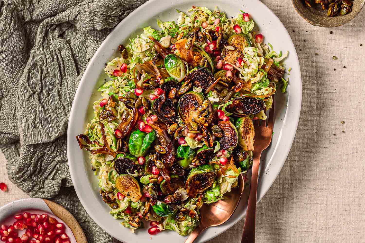Overhead of Raw and Caramelized Brussels Sprouts With Salty-Sweet Pepitas